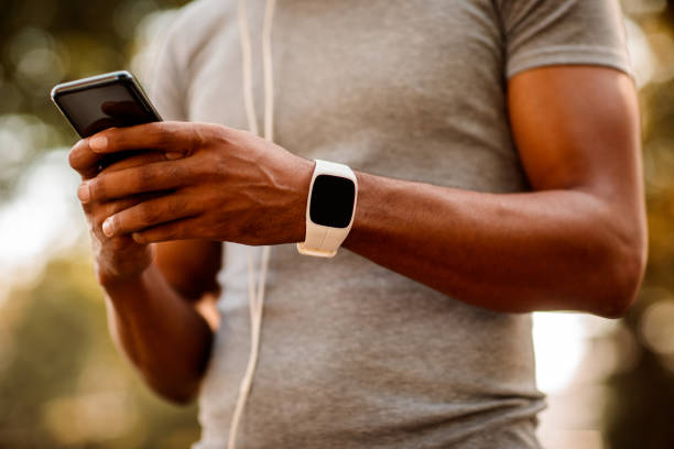 istock Sportsman texting on mobile phone 1062829326