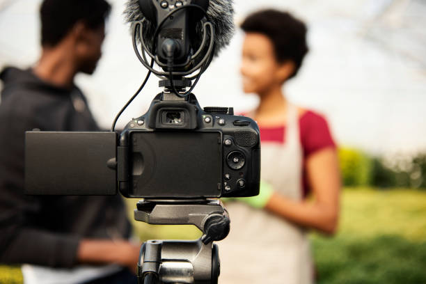 istock Young couple vlogging in greehouse 1062830974