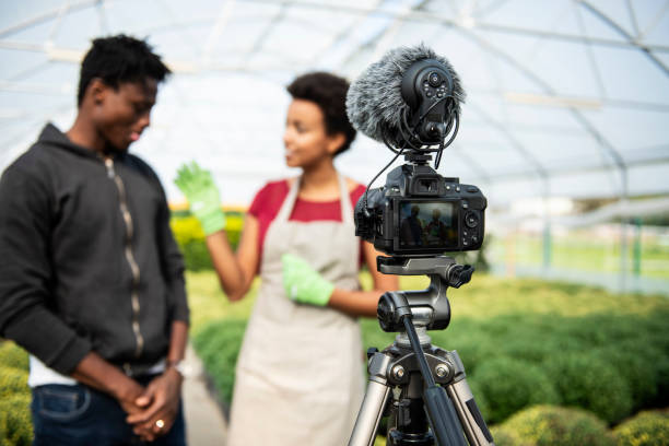istock Young couple vlogging in greehouse 1062830984