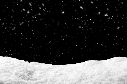 Nieve en fondo negro con nieve. Telón de fondo de Ventisquero en temporada de invierno. photo