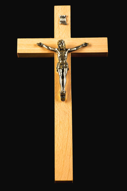 istock Wooden illuminated crucifix on a black background 1062835320