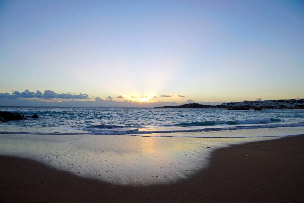 istock Sunrise over the ocean. Beach and surf. Blue sky 1062838048