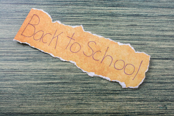 istock Back to school wording on  torn paper 1062838262