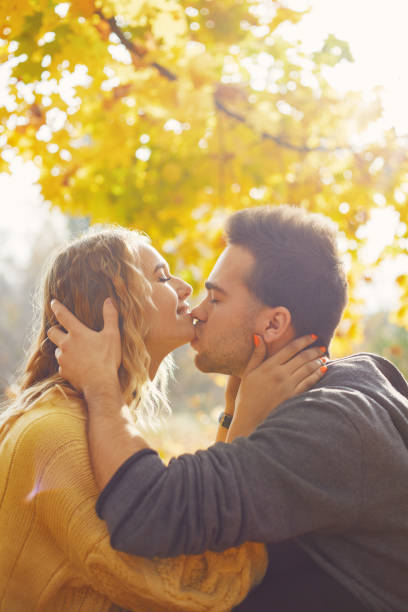 istock Young couple in love in autumn forest 1062838366