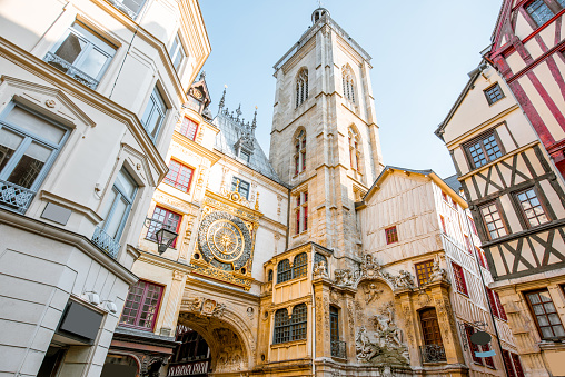 Street view with ancient buildings and Great clock on renaissance arch, famous astronomical clock in Rouen, the capital of Normandy region