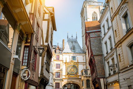 Street view with ancient buildings and Great clock on renaissance arch, famous astronomical clock in Rouen, the capital of Normandy region