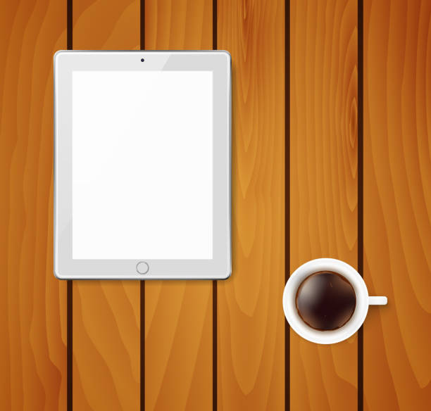 istock Realistic tablet pc computer with blank screen and cup of coffee. 1062844004
