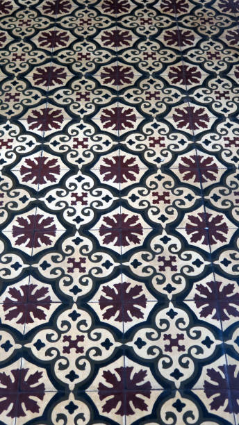 istock Brown and white floor tiles with floral design 1062851190