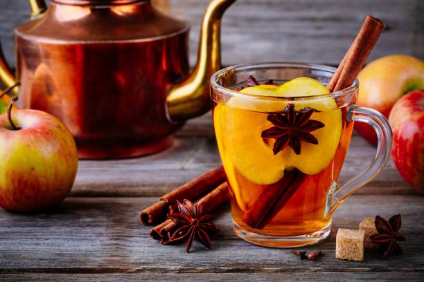 istock Hot mulled apple cider drink with cinnamon stick, cloves and anise 1062851476