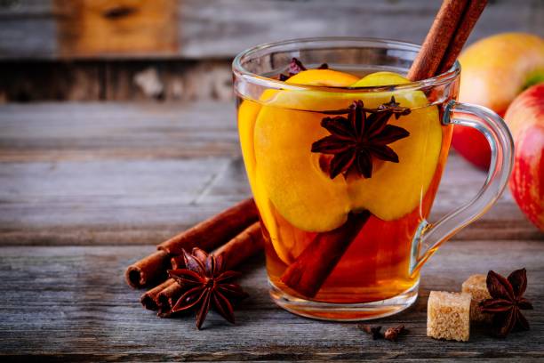 istock Hot mulled apple cider drink with cinnamon stick, cloves and anise 1062851540