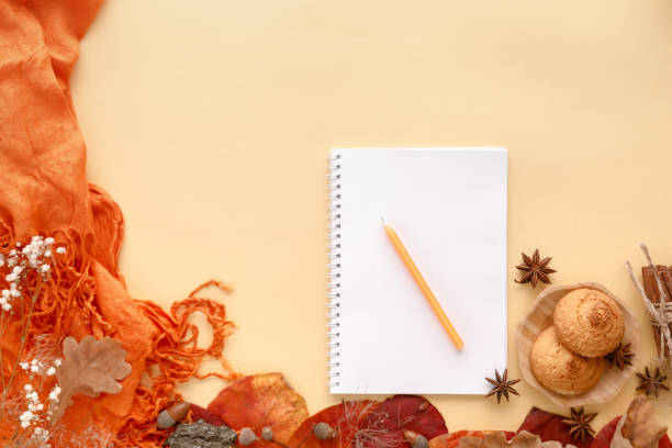 istock autumn leaves, cookies and paper notebook, flat lay 1062852014