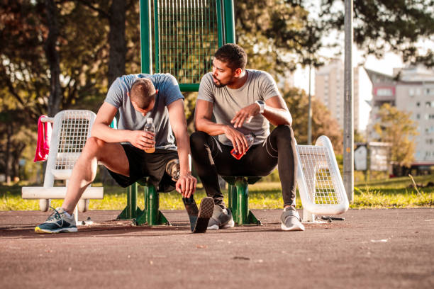 istock Friends resting and hydrating after exercise 1062853714