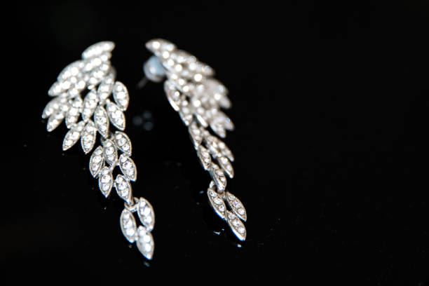 istock Chic earrings on the black background 1062855622