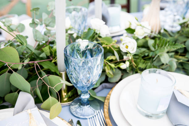 istock Aqua blue wine glass on decorated table 1062855734