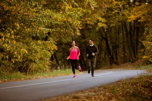 istock Young people jogging and exercising in nature 1062857926