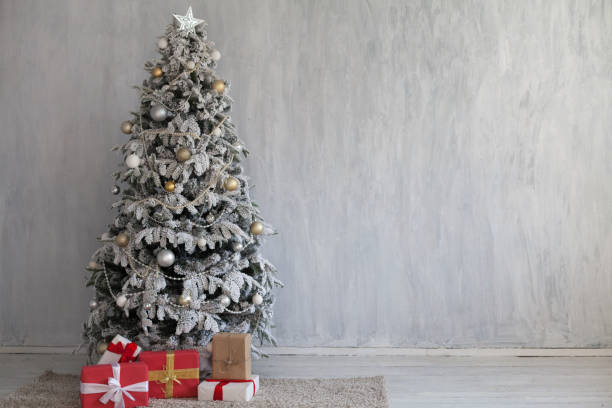 istock winter Christmas new year tree gifts home 1062858018
