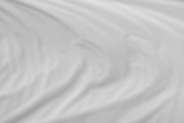 istock folded blue material texture with removed focus - abstract photo background for background use. 1062858298