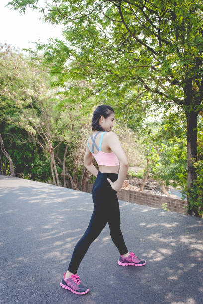 istock Woman exercising in the park 1062863266