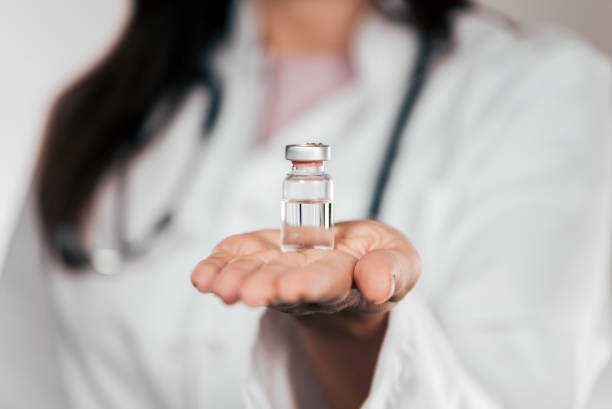 istock Medicine bottle for injection in female doctor's hand. 1062863470