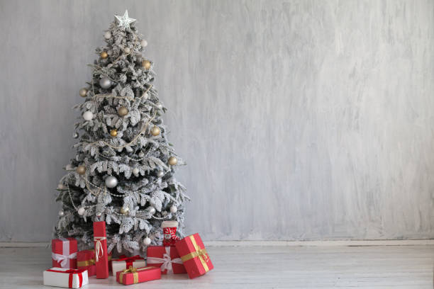 istock winter Christmas new year tree gifts home decor 1062869336