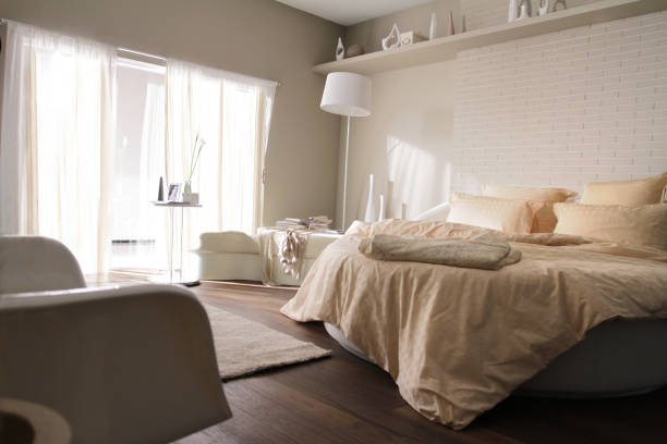 istock round bed in beige bedroom 2 1062874728