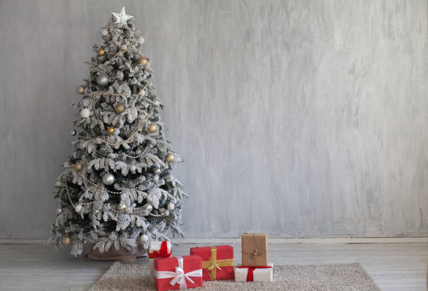 istock winter Christmas new year tree gifts home decor 1062875184