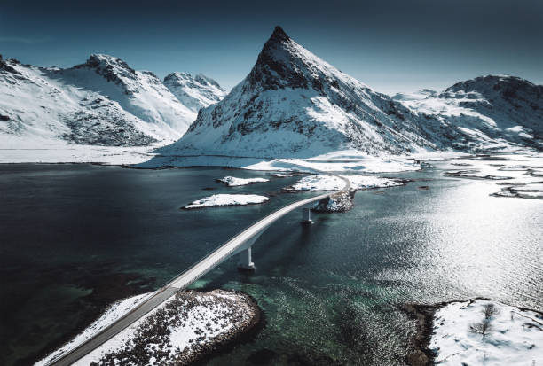 winter view of the bridge at the lofoten islands winter view of the bridge at the lofoten islands lofoten and vesteral islands photos stock pictures, royalty-free photos & images