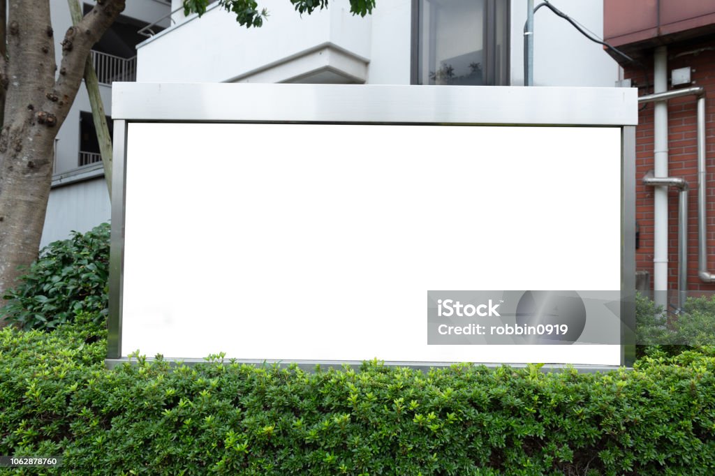Large blank billboard on a street wall, banners with room to add your own text Sign Stock Photo