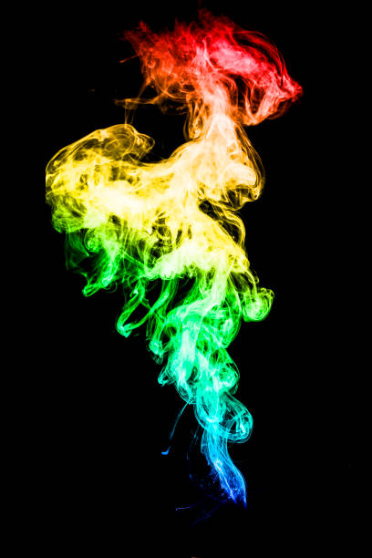 istock Abstract colorful background. Moving smoke isolated on black background. 1062881868