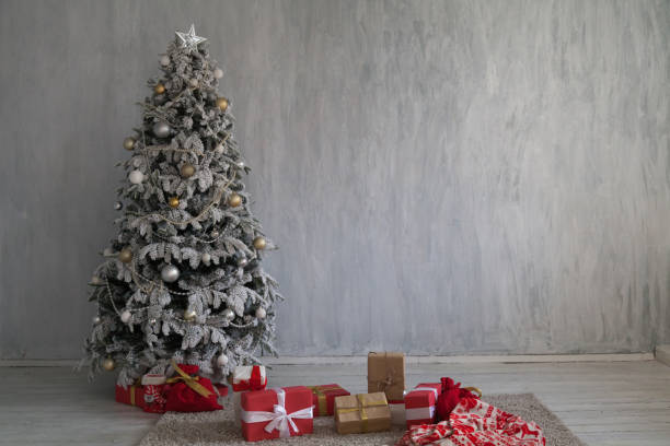 istock winter Christmas new year tree gifts home decor 1062882170