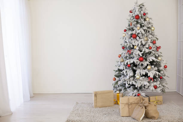istock winter Christmas new year tree gifts home decor 1062885344