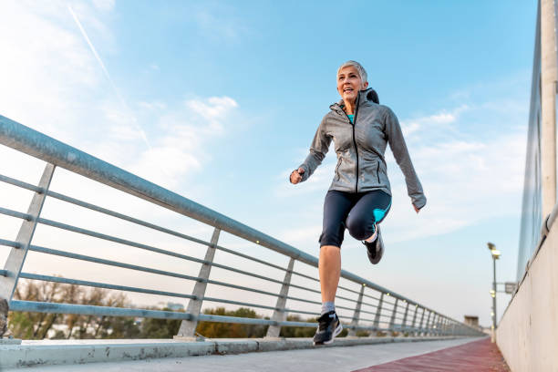 istock Fit mature woman jumping and running 1062885798