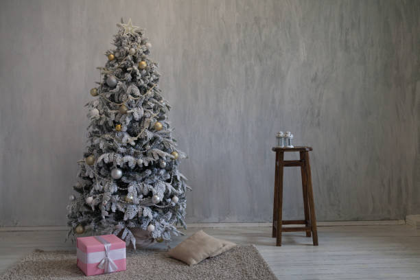 istock Christmas tree with presents, Garland lights new year 1062887790