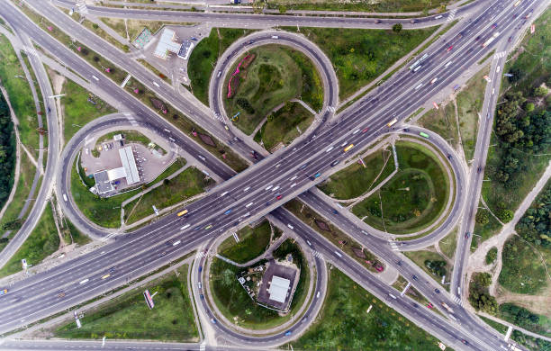 istock Static vertical top down aerial view of traffic on freeway interchange 1062889282