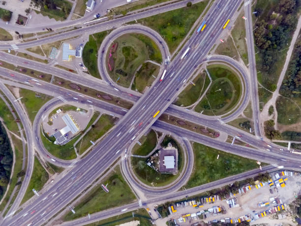 istock Static vertical top down aerial view of traffic on freeway interchange 1062889866