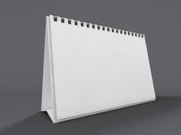 istock Empty desk calendar on table. Mockup design concept. 3D 1062890674
