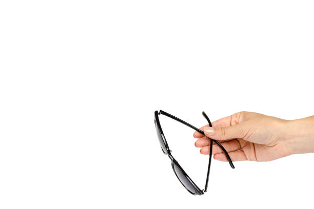 istock Stylish plastic sunglasses with hand isolated on white background, copy space template 1062894336
