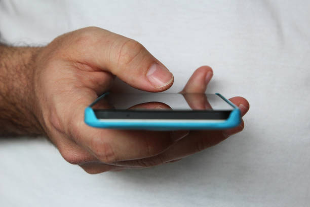 istock Hand holding a smartphone. Social media concept image. 1062898612