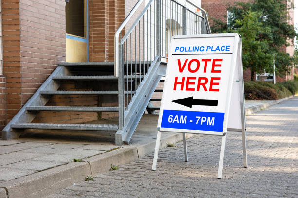 istock Polling Place Vote Here Sign On Board 1062905362