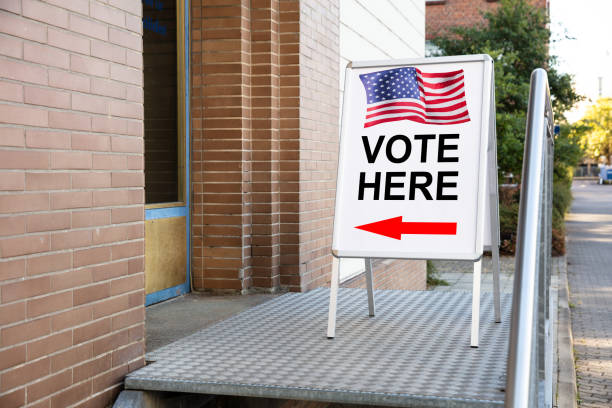 istock Polling Place Vote Here Sign On Board 1062905380