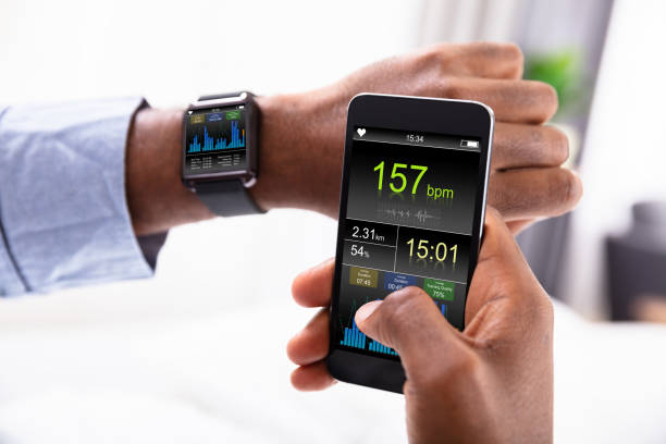 istock Man With Smartwatch And Cellphone Showing Heartbeat Rate 1062905516