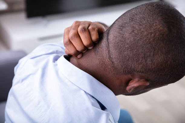 istock Man In Pain Scratching His Neck 1062906804