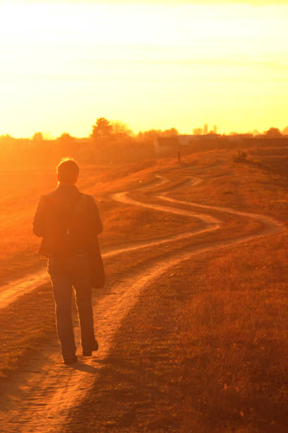 istock Woman photographying sunset with mobile 1062907248
