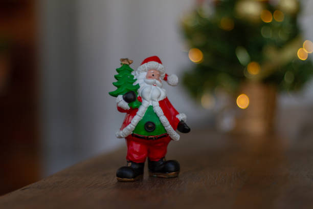 istock Christmas decorations. Santa Claus and Christmas tree in Blurred background. 1062909360