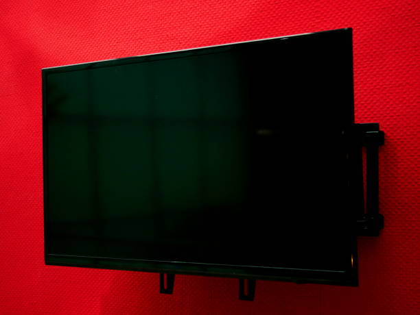 istock Lcd tv on the wall background 1062909948
