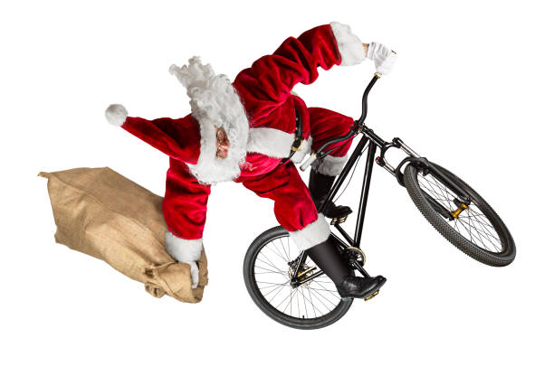 crazy santa claus jump on dirt mountain bike with jute burlap bag isolated crazy santa claus jump on dirt mountain bike with jute burlap bag isolated abstract christmas funny sport white background slopestyle stock pictures, royalty-free photos & images