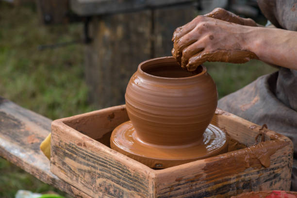 istock Potter is crafting clay pot in the summer 1062911934