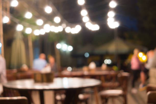 istock Blurred night street illuminated cafe interior background 1062912402