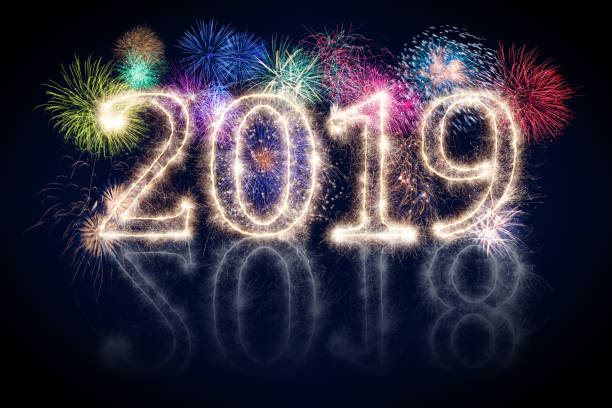 istock colorful fireworks display and bright sparkler pyrotechnic number 2019 happy new year 1062914206