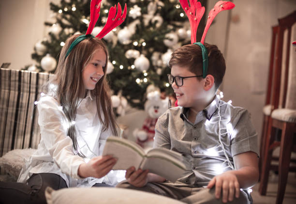 istock Reading a Book on Christmas Eve 2019 1062922116